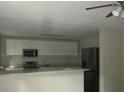 Updated kitchen with stainless steel appliances and granite countertops at 214 W Dade Ave, Bushnell, FL 33513