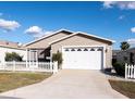 House exterior with white picket fence at 1251 Jonesville Ter, The Villages, FL 32162