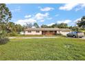 Front view of a ranch-style home with a brick facade and a two-car garage at 5011 Griffin View Dr, Lady Lake, FL 32159
