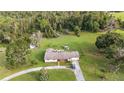 Aerial view of a ranch-style home with a large yard and detached building at 5011 Griffin View Dr, Lady Lake, FL 32159