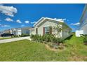 Single-story house with a landscaped front yard and attached garage at 656 Daring Dr, Davenport, FL 33837