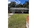 One-story house with gray siding and brick accents at 620 Gould St, Eustis, FL 32726