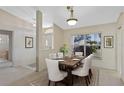 Bright dining room with table and chairs, adjacent to the entryway at 5729 King James Ave, Leesburg, FL 34748