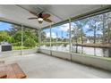 Spacious screened porch overlooking a tranquil pond at 1020 Hilltop Rd, Tavares, FL 32778