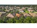 Aerial view of a residential neighborhood showcasing numerous homes and lush green landscaping at 1429 Sw 160 Ln, Ocala, FL 34473