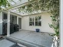 Covered patio with pergola, two grills, and a stone floor at 3358 Quail Hollow Ct, The Villages, FL 32163