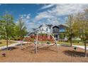Community playground with modern climbing structure at 10156 Ballast Dr, Orlando, FL 32827