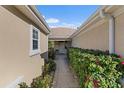 Pathway to the front door, with lush landscaping on both sides at 13495 Se 93Rd Court Rd, Summerfield, FL 34491