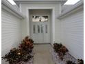 Front entry with walkway and landscaping at 3425 Dixon Ln, The Villages, FL 32162