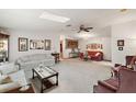 Living room with plush seating and decorative wall art at 25504 Belle Alliance, Leesburg, FL 34748