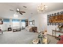 Spacious living room featuring comfortable seating and large windows at 25504 Belle Alliance, Leesburg, FL 34748
