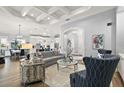 Open living room with hardwood floors and modern furniture at 5096 Greens Dr, Lady Lake, FL 32159