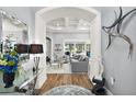 Elegant entryway with high ceilings and views to living room at 5096 Greens Dr, Lady Lake, FL 32159