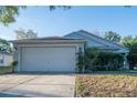 Charming one-story home with a two-car garage and well-maintained lawn at 1836 Ridge Valley St, Clermont, FL 34711