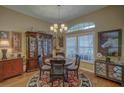 Bright dining room with hardwood floors and a round table at 5000 Portsmouth St, Tavares, FL 32778