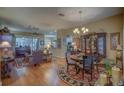 Spacious dining room with hardwood floors and a china cabinet at 5000 Portsmouth St, Tavares, FL 32778