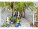 Charming courtyard entry with lush landscaping and seating area at 3721 Plantation Blvd, Leesburg, FL 34748