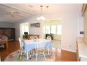 Dining area with light blue tablecloth and wood floors at 1153 Del Toro Dr, The Villages, FL 32159