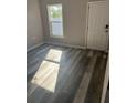 Bright bedroom with vinyl flooring and large window at 339 Maple St, Daytona Beach, FL 32114