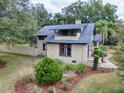 House with a large backyard, surrounded by trees and landscaping at 351 W 10Th Ave, Mount Dora, FL 32757