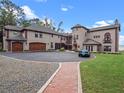 Impressive lakefront home with a 3-car garage and beautifully landscaped grounds at 6118 Dora Dr, Mount Dora, FL 32757