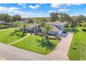 Aerial view of house showing landscaping and large yard at 7350 Spring Mountain Ln, Yalaha, FL 34797