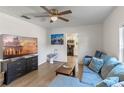 Bright living room with sectional sofa and large TV at 1109 S Smith Ave, Lakeland, FL 33815