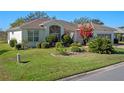 Well-maintained house with lush landscaping at 21732 King Henry Ave, Leesburg, FL 34748