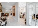 Bright entryway with marble floors and views into the kitchen and living room at 39851 & 39855 Darlington Ave, Lady Lake, FL 32159