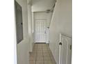 Clean hallway with tile floors and white walls at 652 Chelsea Dr, Davenport, FL 33897