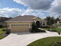 One-story home with a two-car garage and landscaped yard at 1010 Nantucket Sound, Mount Dora, FL 32757