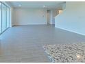 Bright living room featuring tile flooring and sliding glass doors at 14255 Crest Palm Ave, Windermere, FL 34786