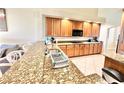 Kitchen with granite countertops and stainless steel appliances at 26635 Bella Vista Dr, Howey In The Hills, FL 34737