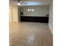 Spacious dining area with dark cabinets and tiled floors at 2950 Peach St, Leesburg, FL 34748