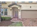 Inviting exterior with a two-car garage and a brick walkway at 1603 Lima Ave, Kissimmee, FL 34747