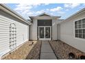 Inviting front entry with screened door and a stone pathway at 25114 Meriweather Rd, Leesburg, FL 34748