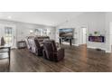 Spacious living room with hardwood floors and fireplace at 3927 Oak Pointe Dr, Lady Lake, FL 32159