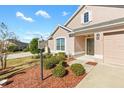 House exterior showcasing a front entrance and landscaping at 1429 Bluebeard Ct, The Villages, FL 32163