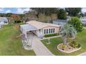 Aerial view of the manufactured home, highlighting its landscaping and location at 1609 Doral Cir, The Villages, FL 32159