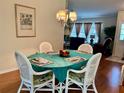 Bright dining room with a teal tablecloth and wicker chairs at 5006 El Destino Dr, Leesburg, FL 34748