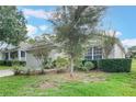 One-story house with a one-car garage and manicured lawn at 4130 Capland Ave, Clermont, FL 34711