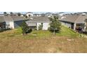Aerial view of homes with backyard and landscaping at 29549 Caspian St, Leesburg, FL 34748