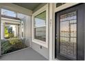 Front door entrance with lake views at 561 Juniper Springs Dr, Groveland, FL 34736