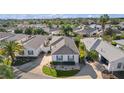 Aerial view of villa community near a lake at 1234 Estill Ave, The Villages, FL 32162