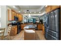 Spacious kitchen with granite countertops and stainless steel appliances at 41 Camino Real Blvd # 41, Howey In The Hills, FL 34737
