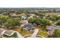 An aerial view showcasing the house's location and surrounding neighborhood at 14701 Timucua Pl, Clermont, FL 34711