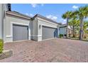 Two-car garage with paver driveway at 955 Ladera Ranch Rd, Kissimmee, FL 34759