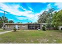 Ranch style home with screened porch and mature landscaping at 133 E Lauren Ct, Fern Park, FL 32730