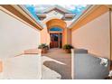 Inviting entryway with a double door and terracotta flooring at 1589 Arial Pl, The Villages, FL 32162