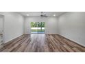 Spacious living area with sliding glass doors leading to the backyard at 40630 E Eighth Ave, Umatilla, FL 32784